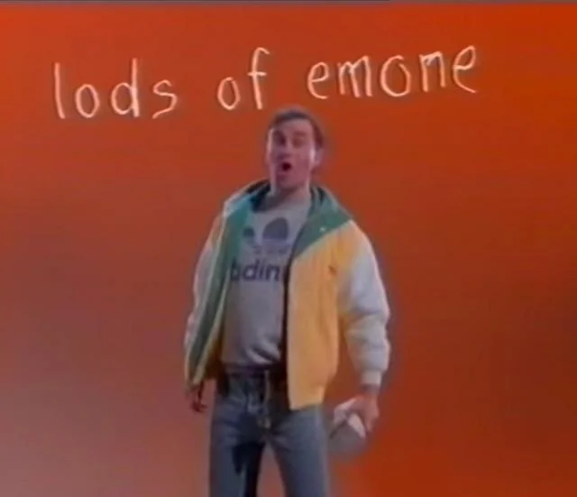 Harry Enfield holding a wad of dosh.
