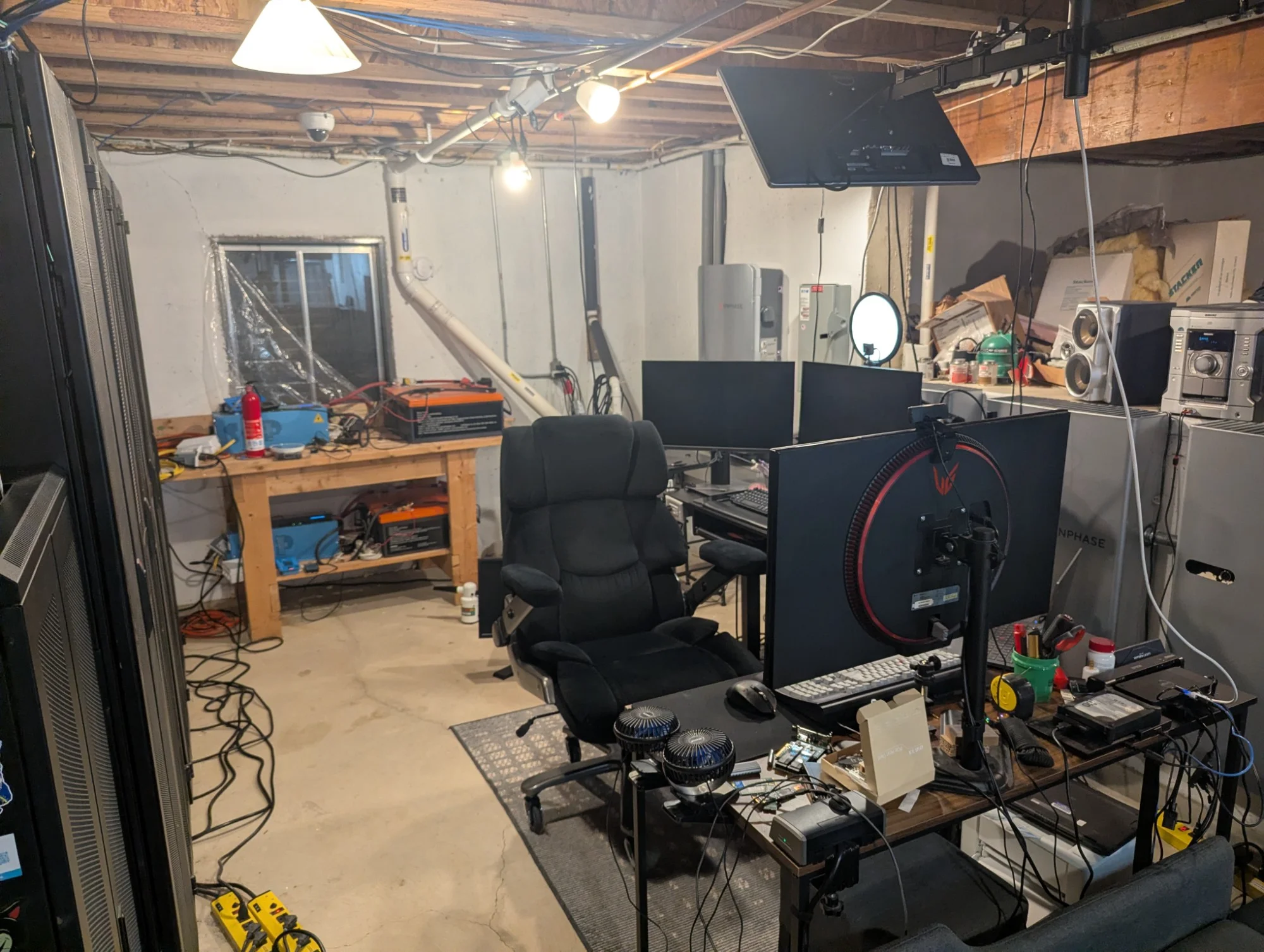 An almost brutalist style office with a bunch of racks. Great heating!